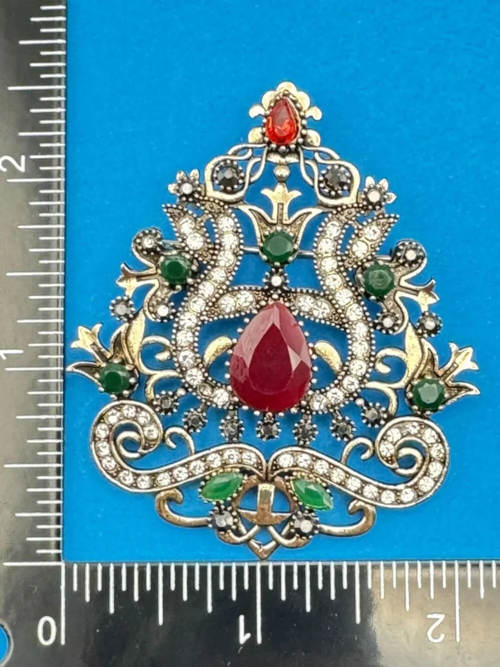 Ornate Shield Brooch Pin Red Green Clear Rhinestones Gold Tone Filigree